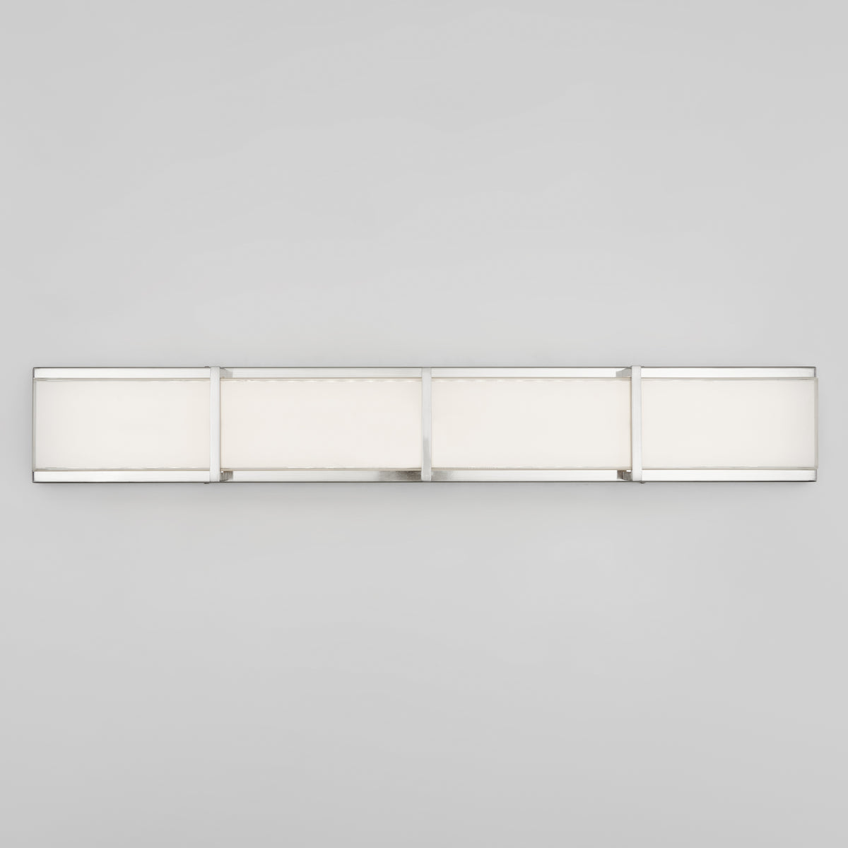 The Artika Subway 35-in (89 cm) Integrated LED Vanity Light Bar features a modern rectangular design with a sleek brushed nickel frame and frosted white panels, mounted on a plain light gray bathroom wall.