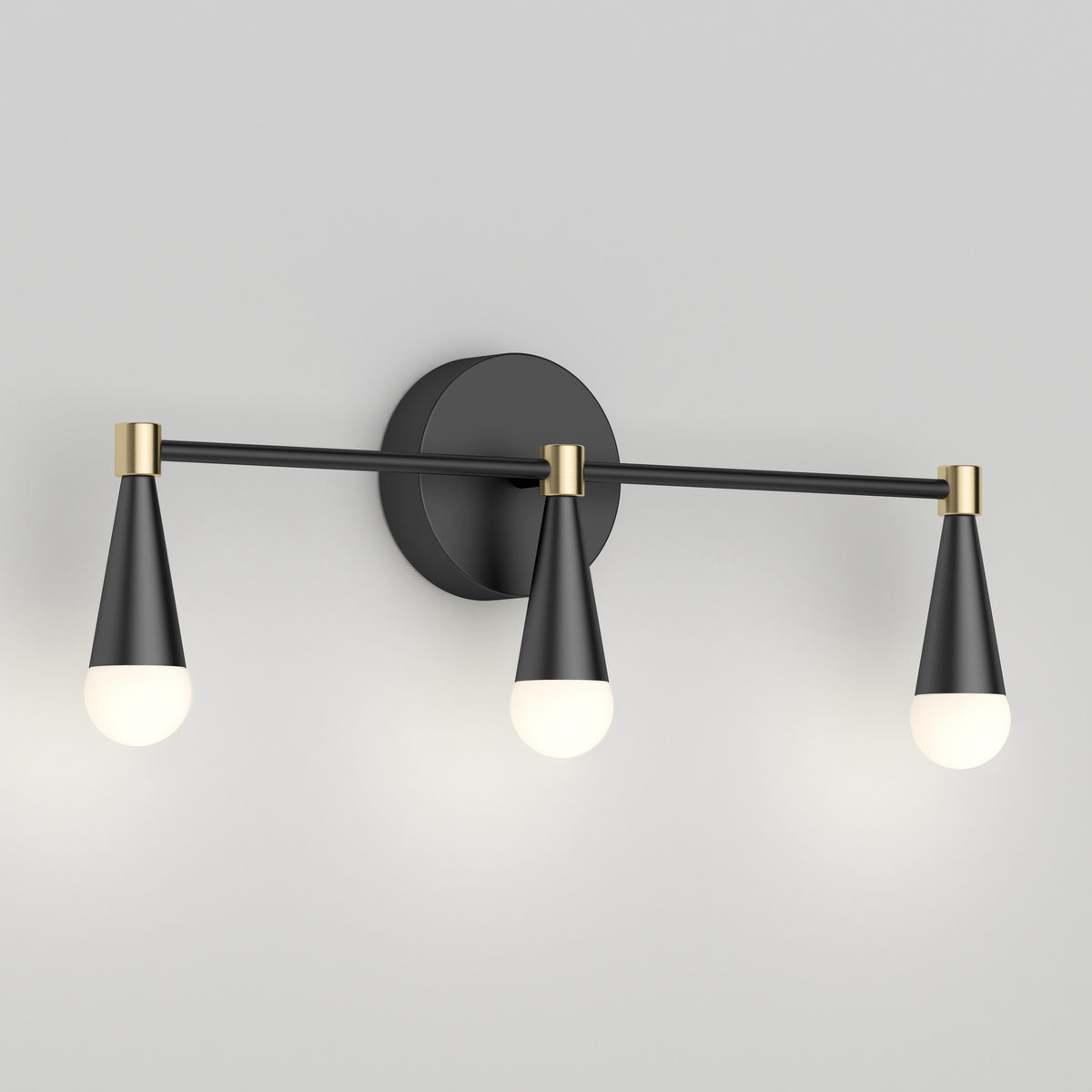 The Artika Wayden LED mid-century bathroom vanity light has 3 cone lights in black/gold, ideal for a chic, modern look.