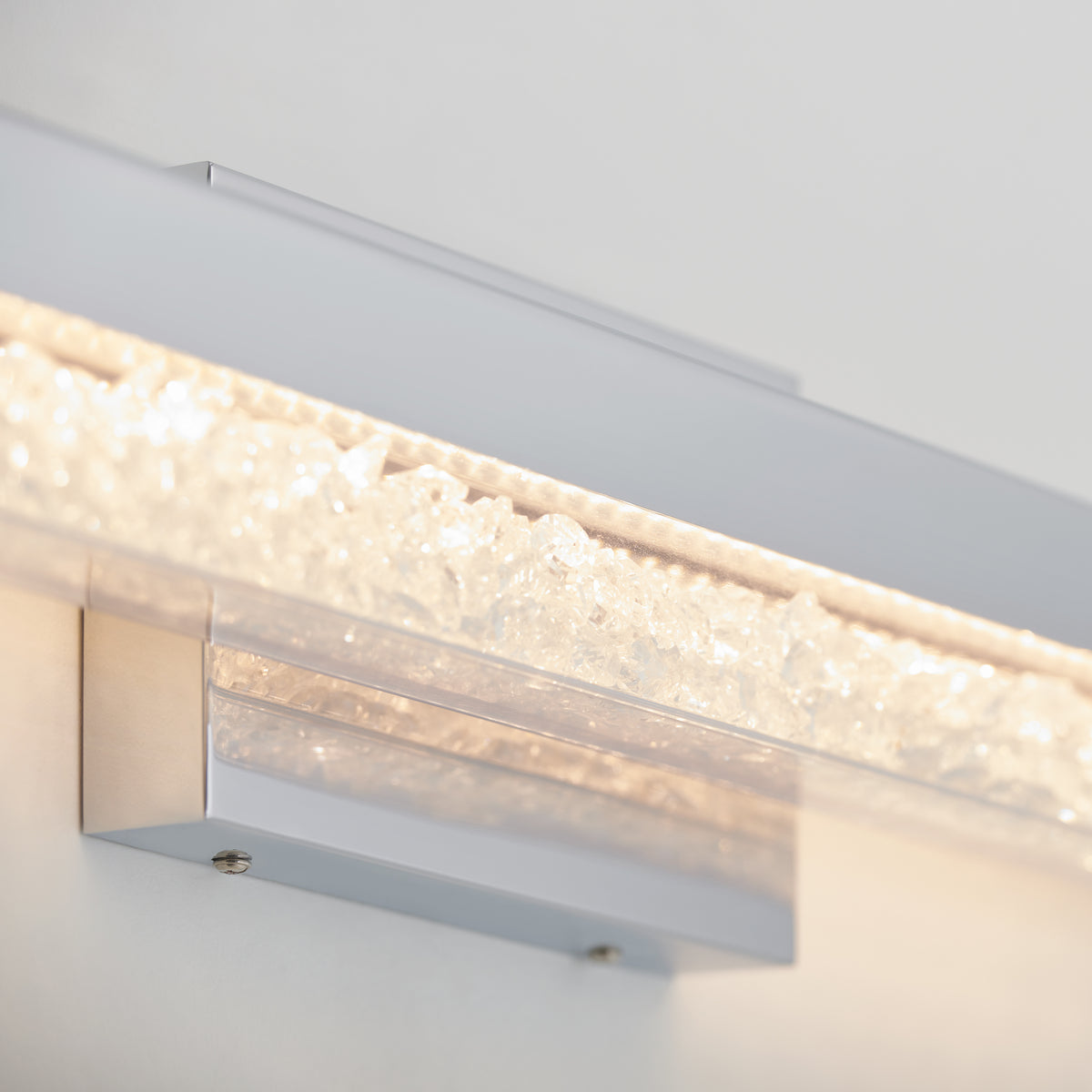 Close-up of the Artika Riviera modern LED bathroom vanity light, featuring a crystal-like design and soft white glow for luxury bathrooms.