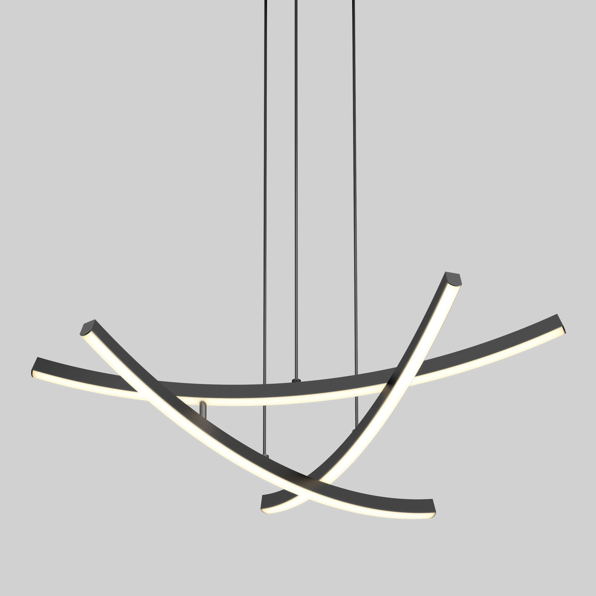 The Orly modern LED pendant light 5 CCT by Artika features three curved black bars suspended by thin wires, each emitting a soft white glow in an abstract intersecting design against a plain gray background.