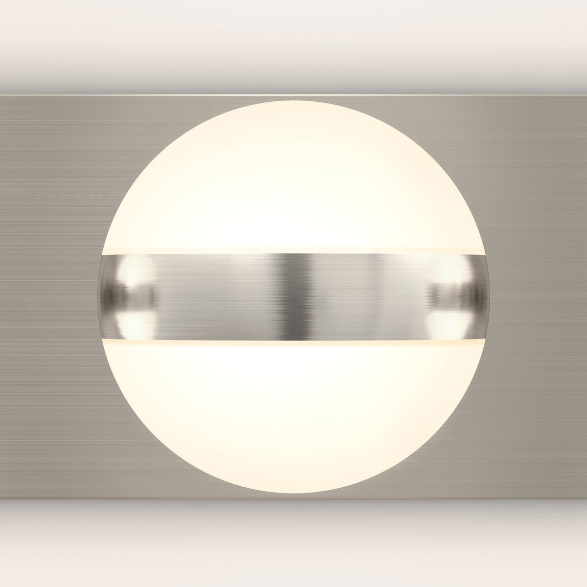 The Artika Baldric LED modern bathroom vanity light 3 CCT features a frosted globe and metallic band, ideal for mirror lighting.