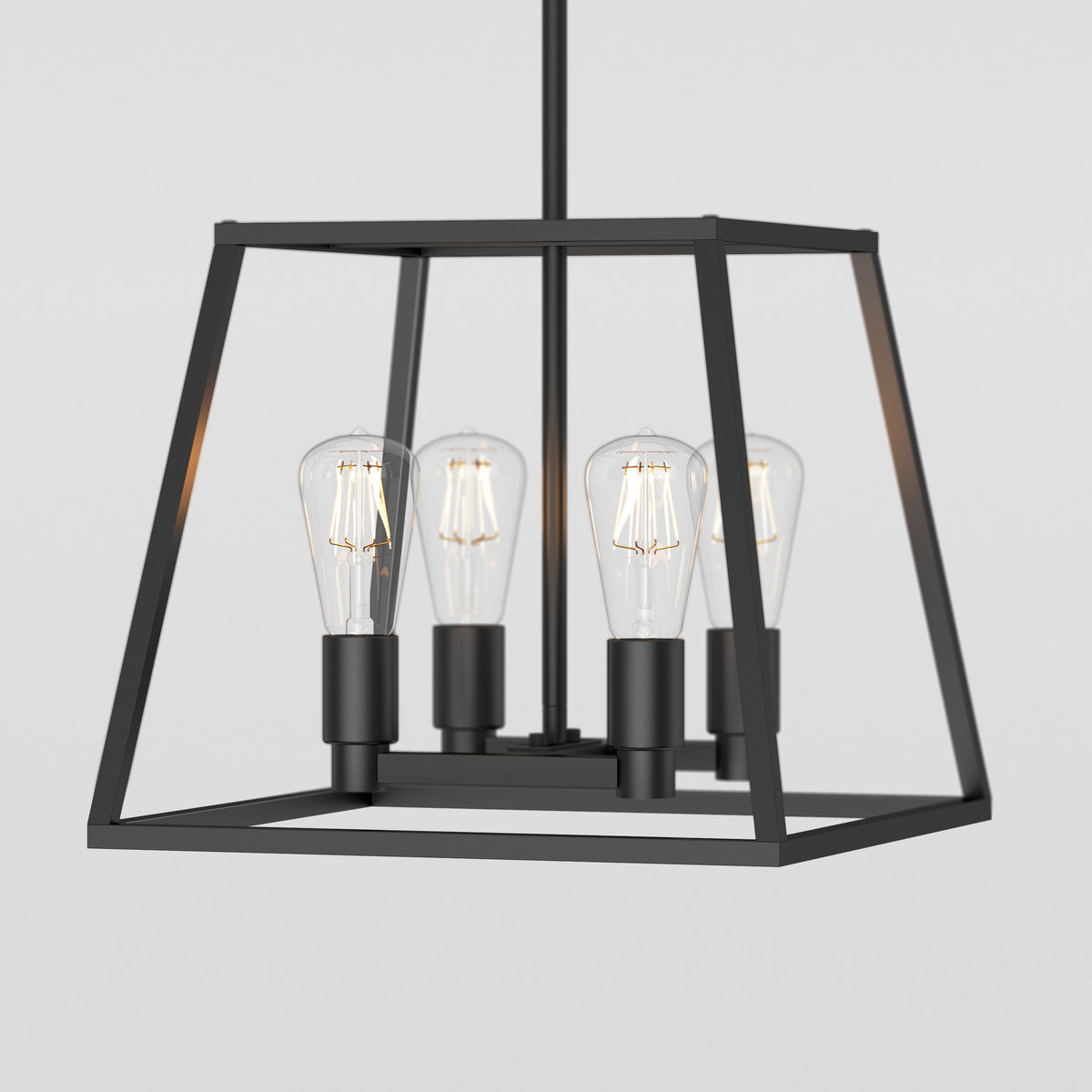 The Artika Carter Square 4-light Chandelier features a modern geometric open cube design with a black metal frame and four exposed Edison-style bulbs.
