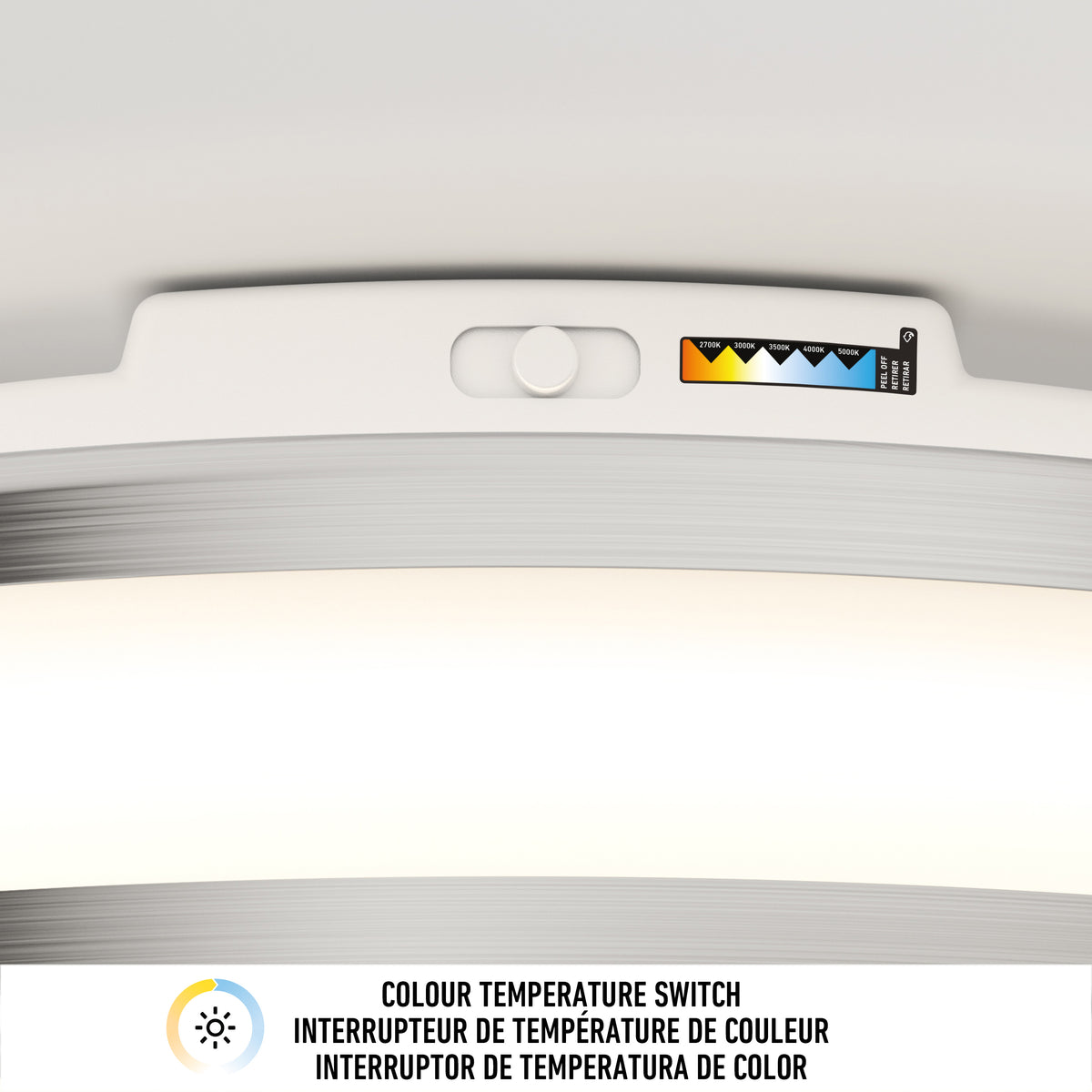 Close-up of the Artika Hemisphere 15 in. LED flush mount light with adjustable brightness, a 5 CCT color temperature switch, and labeled scale. "Colour Temperature Switch" appears in English, French, and Spanish. Ideal for bathrooms.