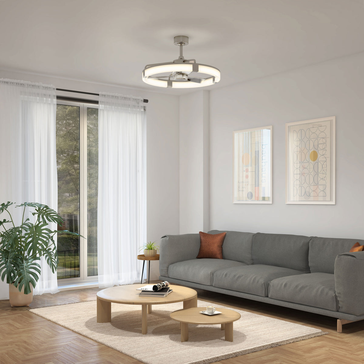 Modern living room with gray sofa, round tables, potted plant, large window with white curtains, and Artika Sunnyvale 28 in. LED fan with remote.
