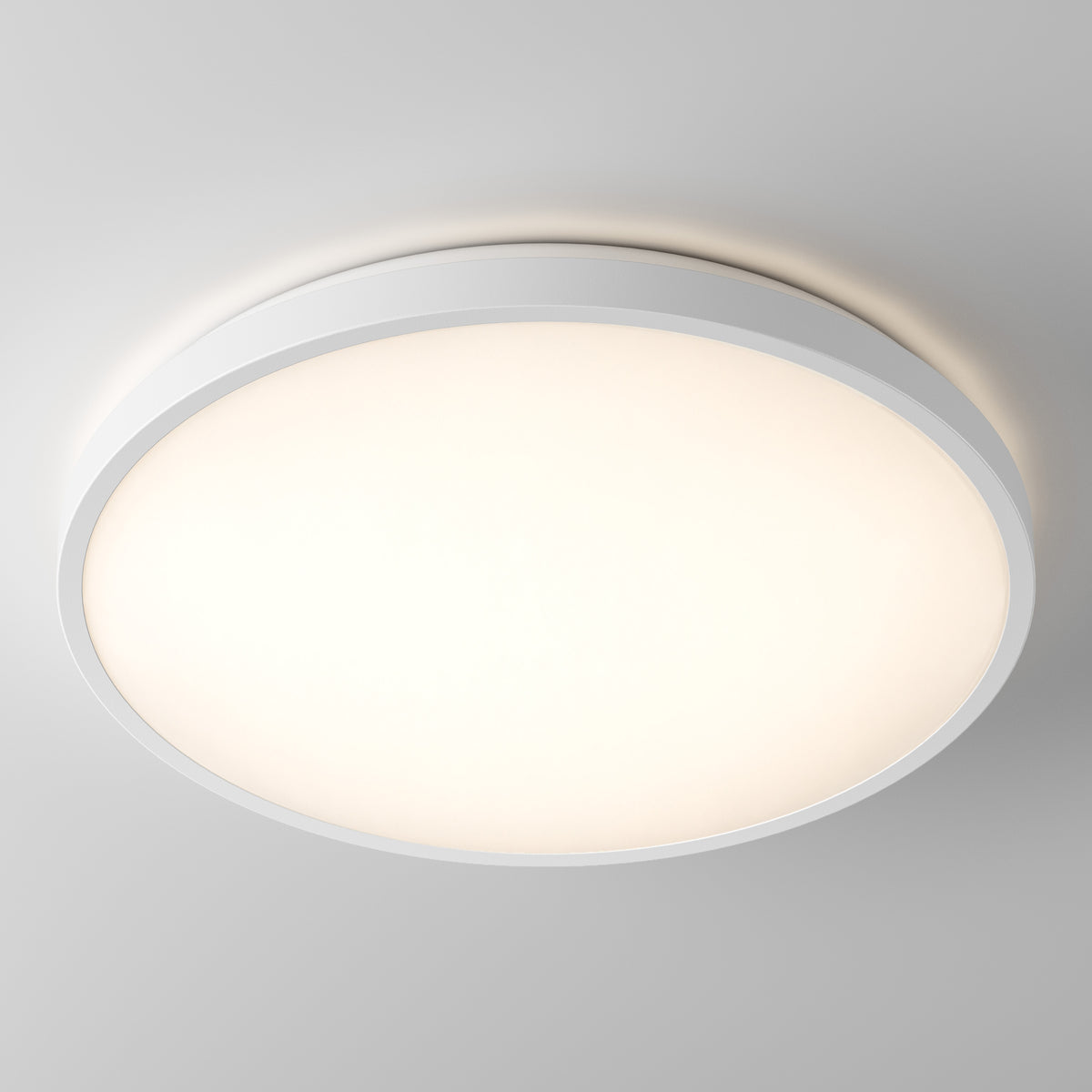 The Isara 15″ RGBIC LED Flush Mount by Artika glows softly against a plain gray ceiling.