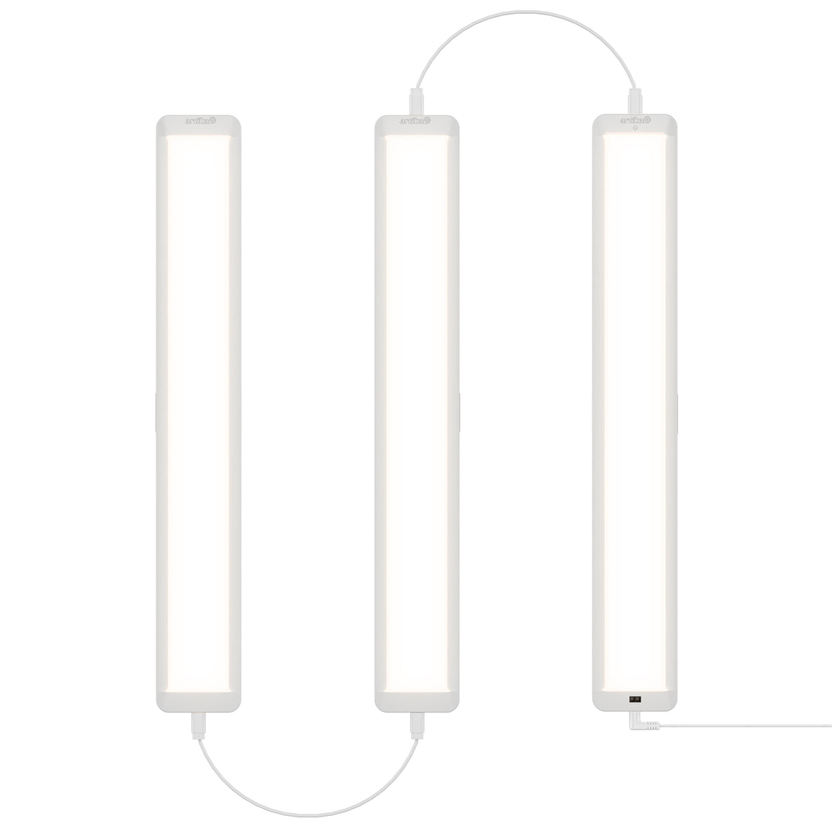 Three Maestro under cabinet LED light 3CCT bars by Artika are connected by cables and arranged vertically side by side against a white background, emitting a bright, even white light.