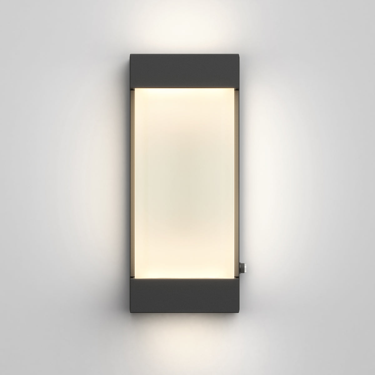The Artika Glacier indoor-outdoor LED wall light features a black frame and frosted center panel, casting a soft, diffused glow on a gray wall.