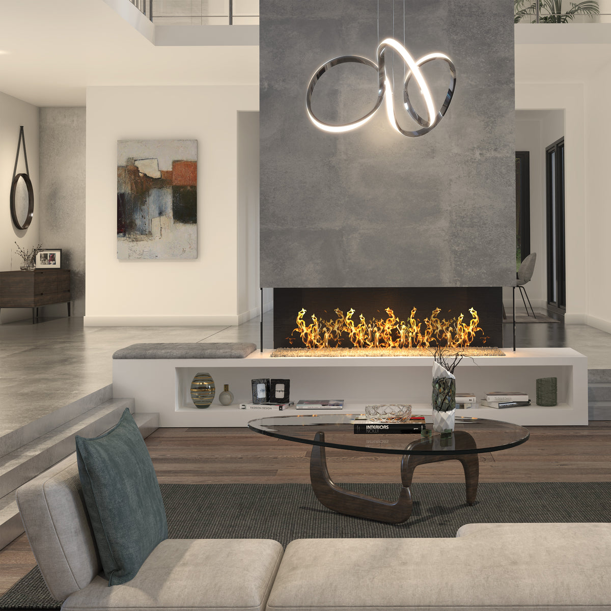 Modern living room with a glass coffee table, sectional sofa, and built-in linear fireplace. An abstract painting hangs on the wall, and the Artika Swirl LED pendant light is suspended from the ceiling above the fireplace.