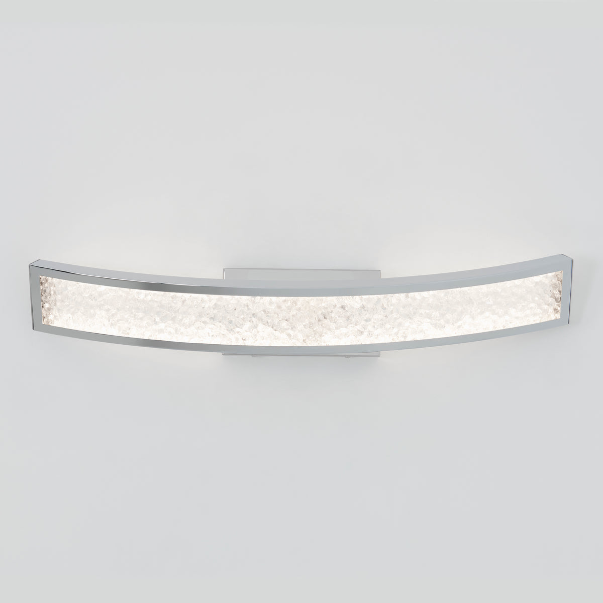 The Artika Glitter 27-in (69 cm) Integrated LED Vanity Light Bar features a sleek chrome finish and a textured, illuminated panel, adding modern elegance when mounted on a plain white bathroom wall.