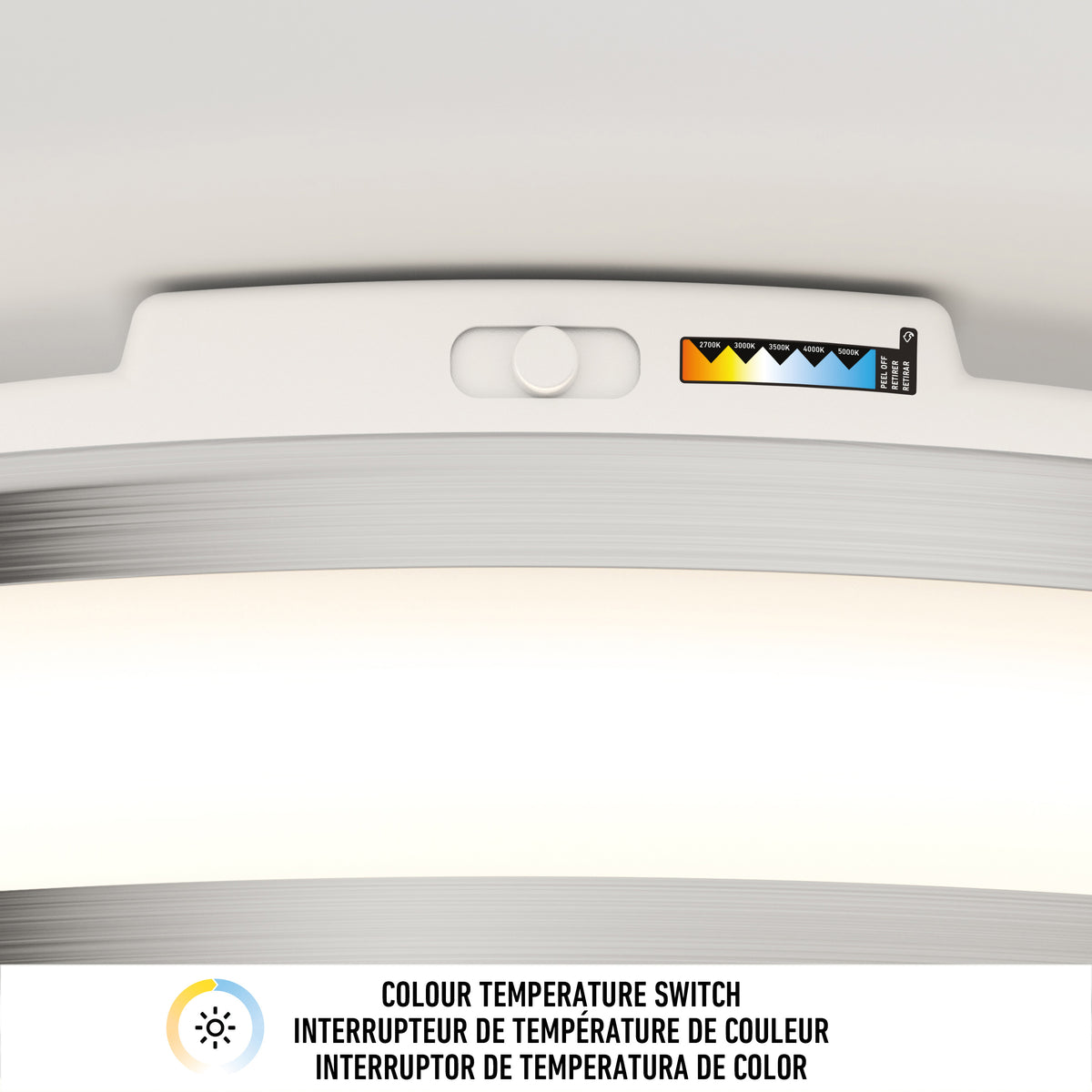 Close-up of the Artika Hemisphere 15 in. LED flush mount light with adjustable brightness and a 5 CCT color temperature switch. A label shows the options with “COLOUR TEMPERATURE SWITCH” in English, French, and Spanish—ideal for bathrooms.