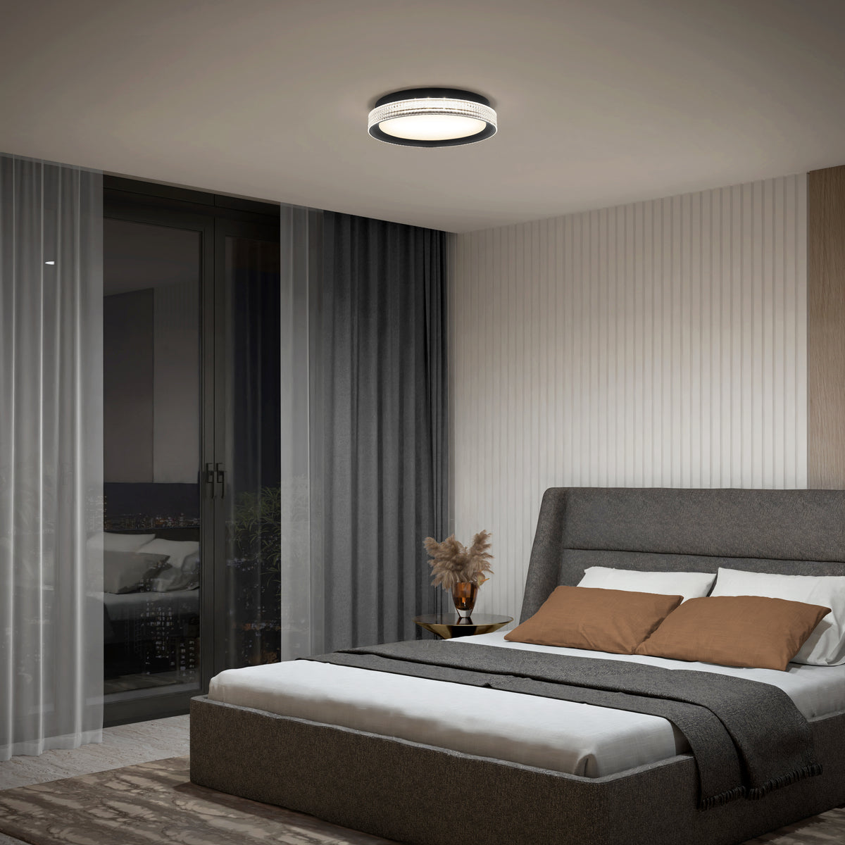 Modern bedroom with a grey upholstered bed, brown and white bedding, gray throw blanket, nightstand with a vase of dried plants, sheer and dark curtains, and the Artika Aston 15 in. LED modern flush mount light (5 CCT) on the ceiling.
