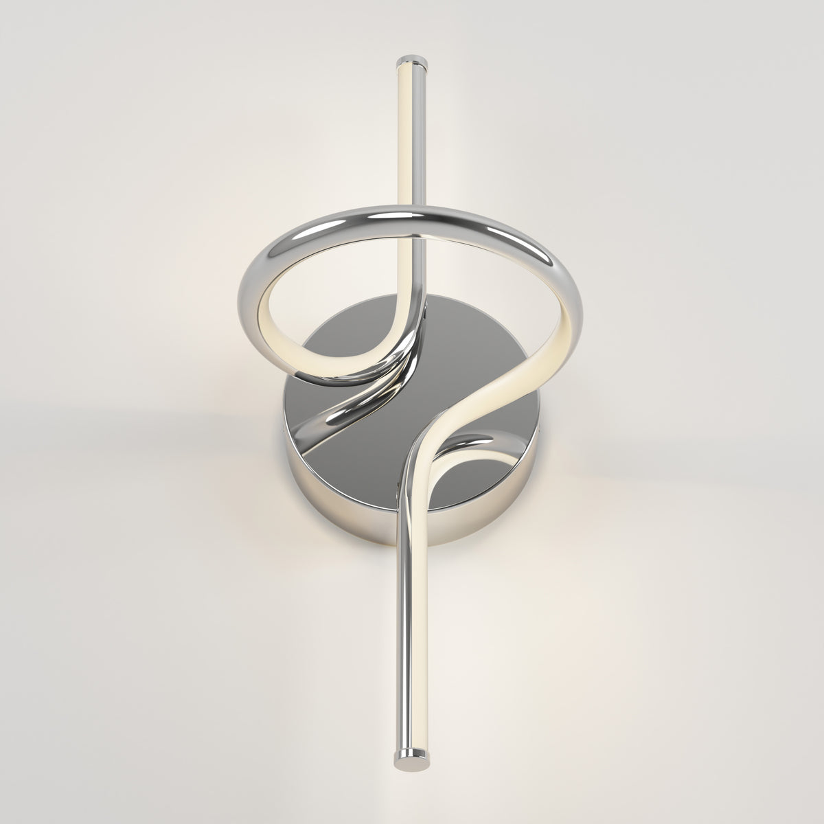 The Swirl LED Sconce by Artika features a circular base, metallic loop design, and an integrated LED light tube wrapping vertically through the center, all finished in sleek chrome.