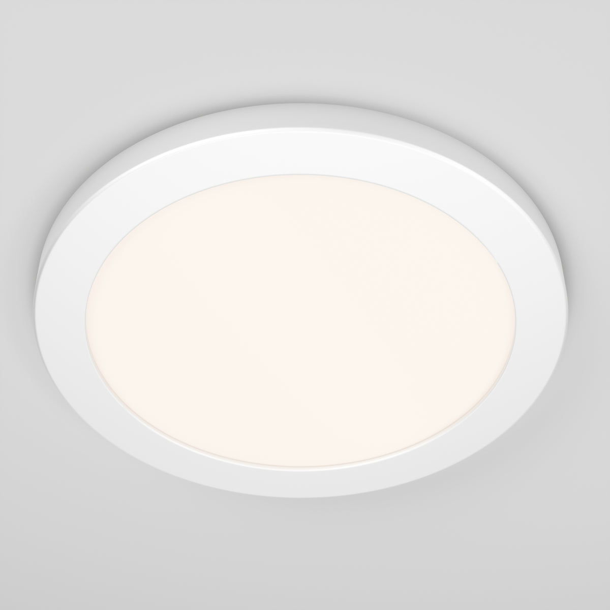 The Artika Europa Disk 9 in. LED modern flush mount light, with selectable 3 CCT, is installed on a smooth, light grey ceiling and emits a soft, even glow.