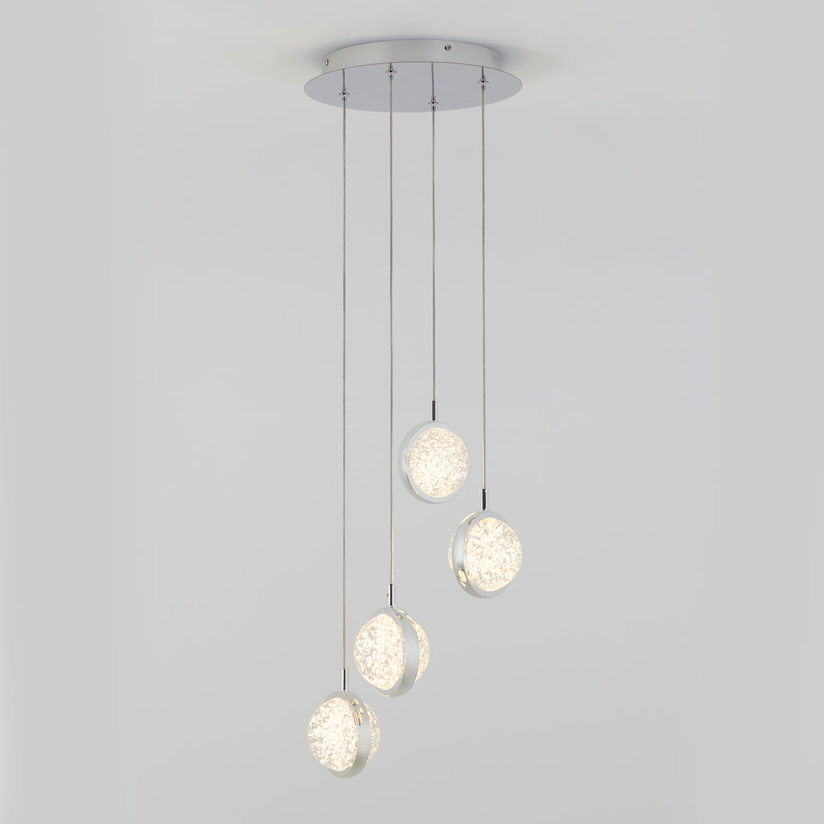 The Artika Avalon 4-light LED pendant features four round illuminated pendants suspended at varying lengths from slim cords, displayed against a plain white background.
