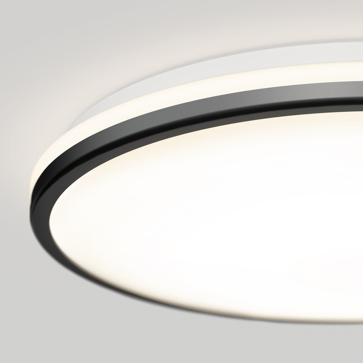 Close-up of Artika Macy 15 in. LED modern flush mount light, Alexa compatible, with black trim and glowing white surface.