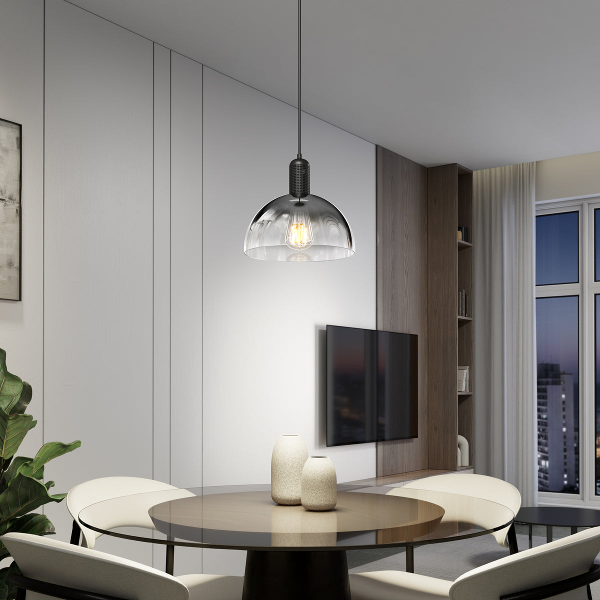 A modern dining area with a round table, four white chairs, two vases, a wall-mounted TV, large windows, neutral-tone decor, and the Artika Nella Pendant without Bulbs hanging overhead.