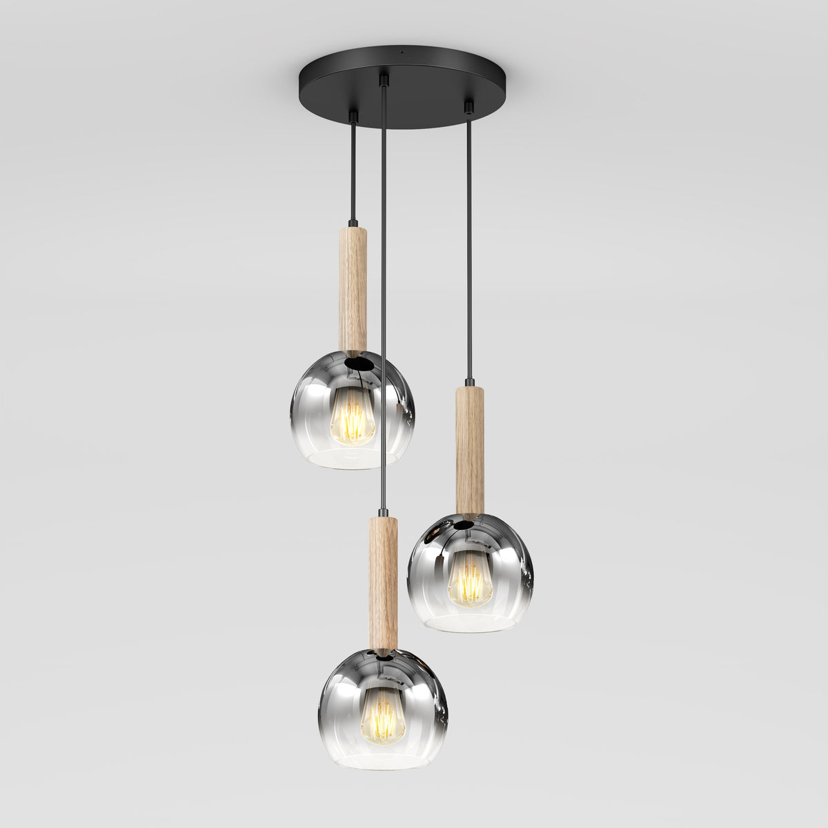 The Artika Ardel Spiral 3-Light Pendant features three reflective glass globes with wooden accents, suspended from a black circular mount. Bulbs not included.