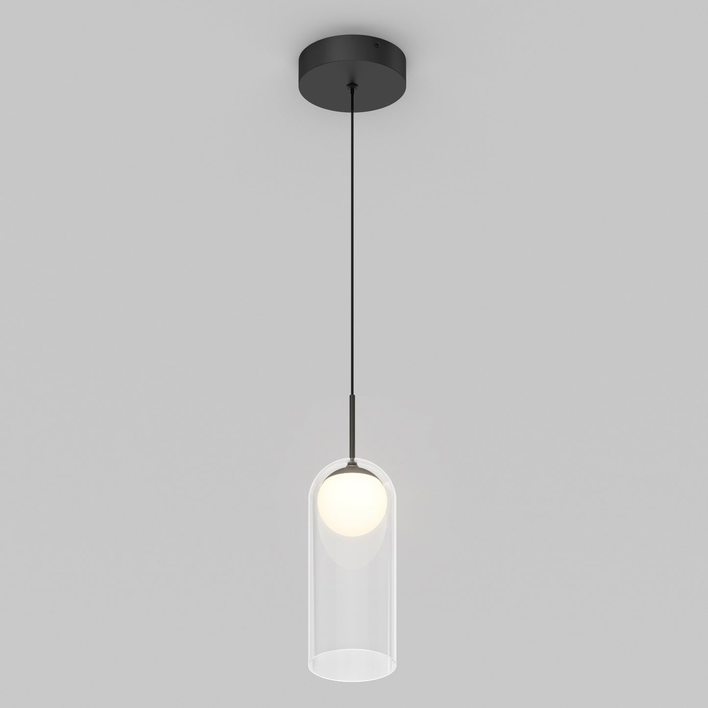 The Artika Mirah LED modern mid-century pendant light 3 CCT features a black ceiling mount and cord with a clear cylindrical glass shade around a glowing bulb, set against a plain light gray background.