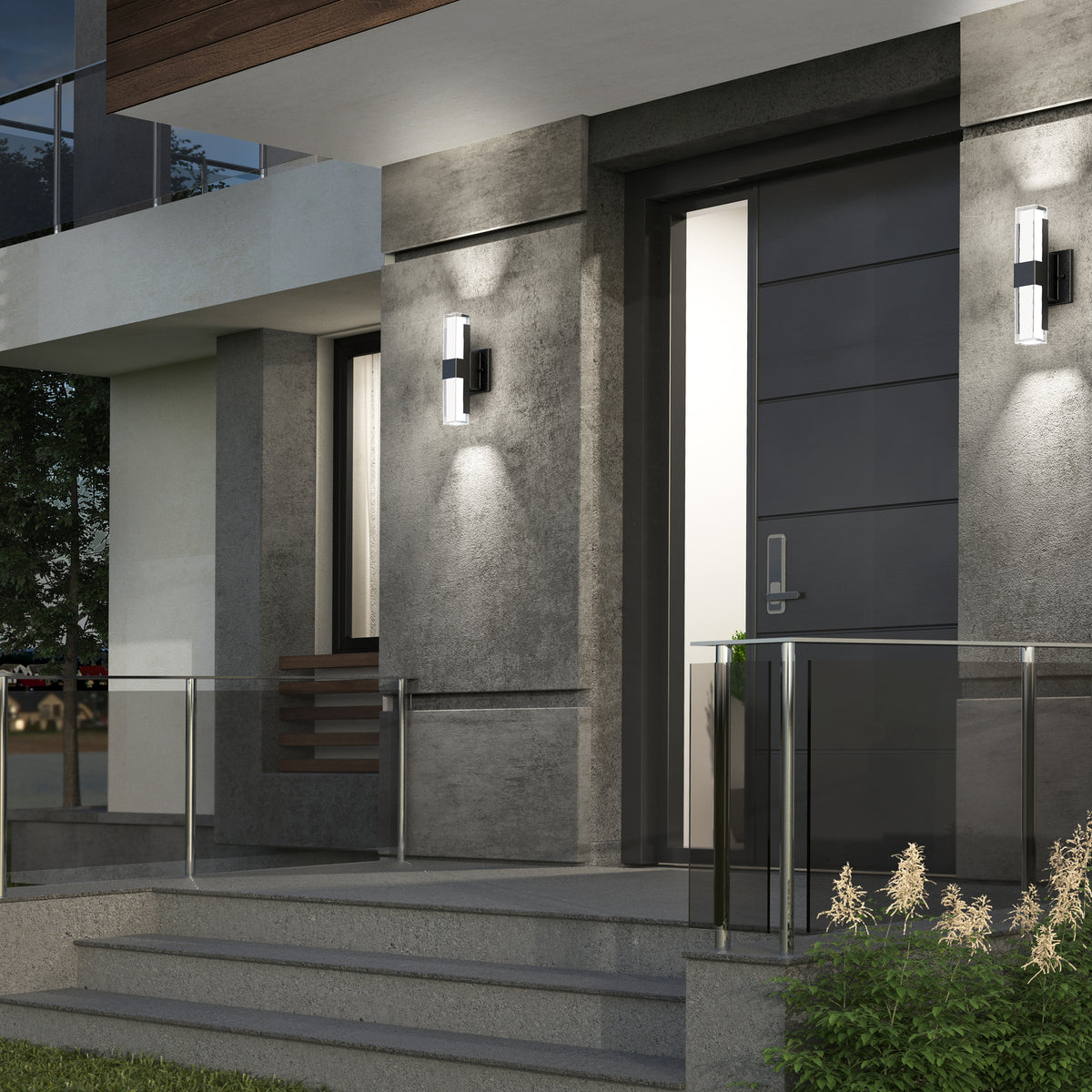 Modern house entrance with gray walls, a sleek dark front door, glass railing, concrete steps, and Artika Gemini indoor-outdoor LED wall lights on either side of the door, plus small plants by the steps.