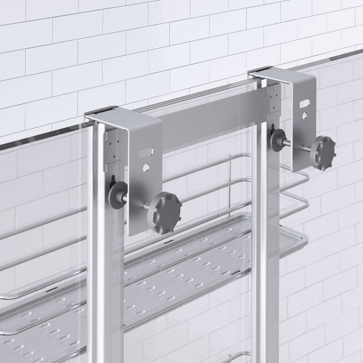 Close-up of the Artika Camden Shower Caddy, a modern glass shower door organizer with metal brackets and knobs, plus a metal shelf and towel rail mounted below the brackets on a tiled bathroom wall.