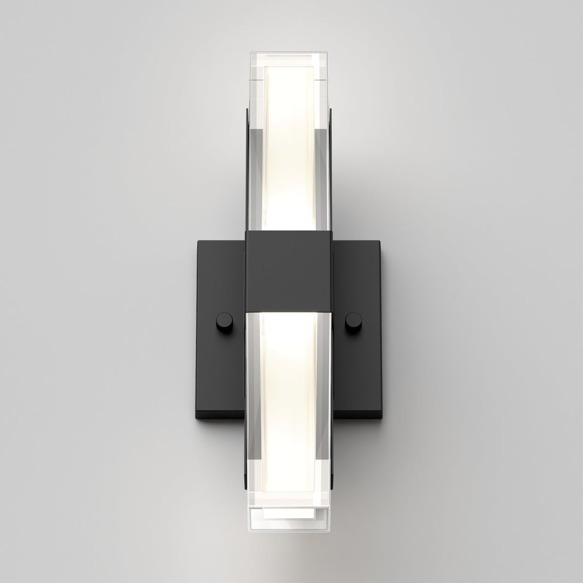 The Artika Gemini indoor-outdoor LED wall light features a modern rectangular black base and two clear panels, mounted vertically on a plain light gray wall.