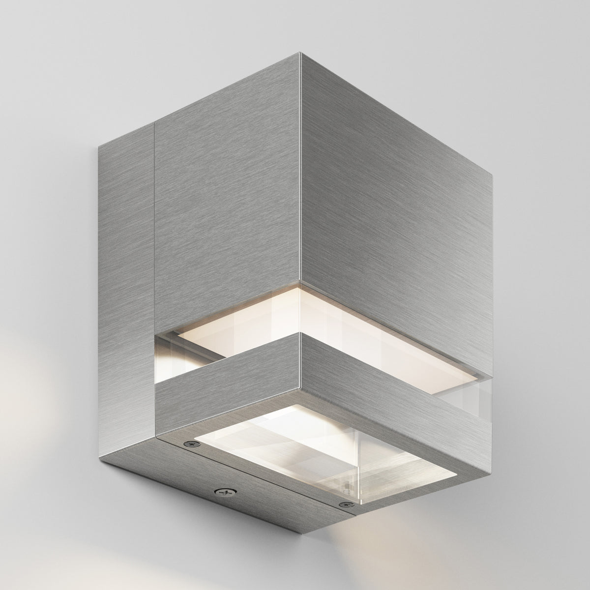 The Artika Valor Square LED indoor-outdoor wall light features a modern cubic design with brushed metal, emitting light from both the top and bottom, shown mounted on a light gray wall.