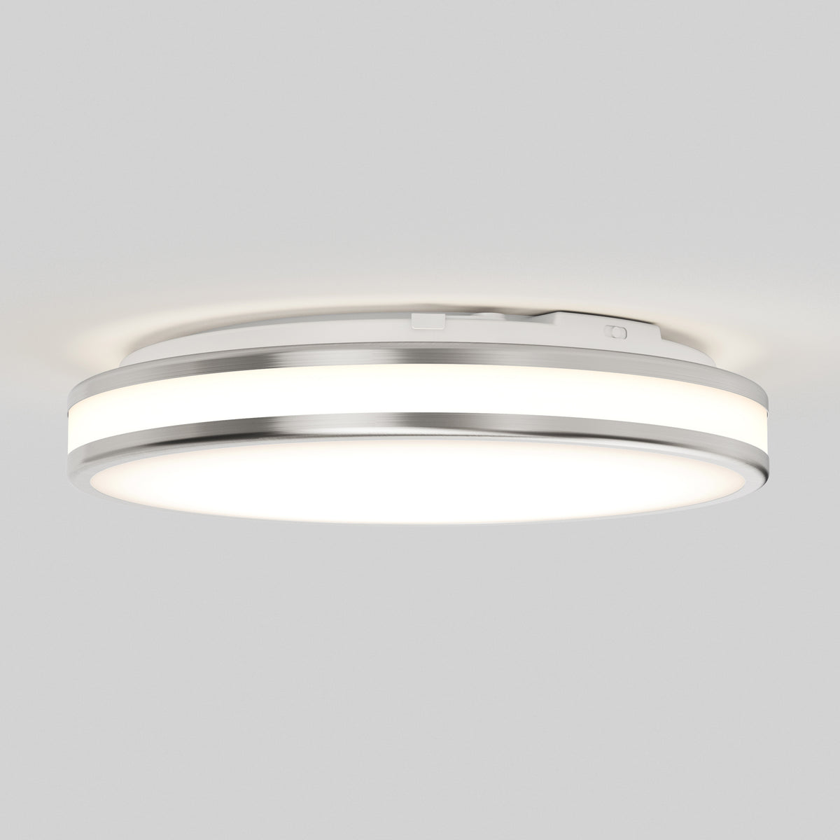 The Artika Hemisphere 15 in. LED flush mount light features a circular design with a metallic rim and frosted diffuser, offering adjustable brightness (5 CCT) for soft, even bathroom lighting on your white ceiling.