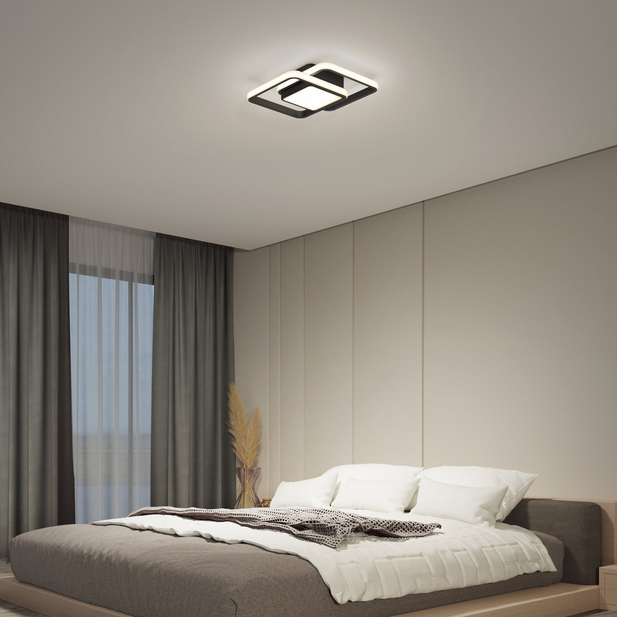 A minimalist bedroom features a large bed with neutral bedding, floor-to-ceiling curtains, and a decorative vase with dried plants. The space is illuminated by the Artika Romeson 11 in. LED modern flush mount light (5 CCT) for a calm, contemporary vibe.