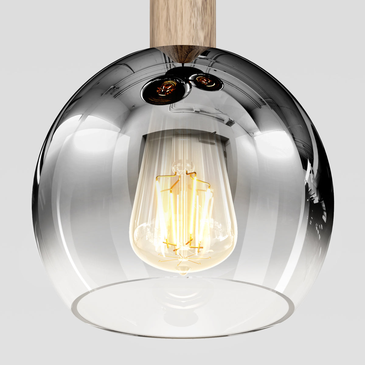 A close-up of the Ardel Spiral 3-Light Pendant by Artika, featuring a clear glass shade and wooden fixture that reflect their surroundings.