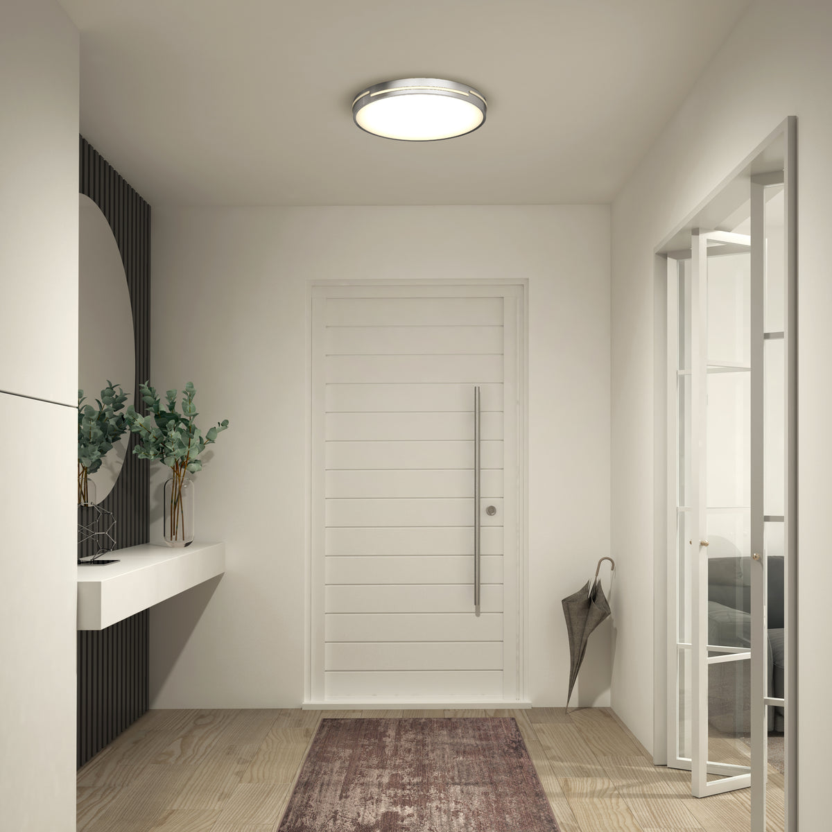 A modern entryway features a white door, Artika Delray 15.7 in. LED modern flush mount light with 5 CCT, console table with greenery, brown rug, wall mirror, and an umbrella by glass double doors.