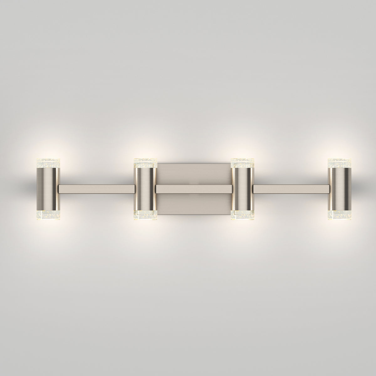 The Artika Mist modern LED bathroom vanity light 5 CCT features a brushed nickel finish with four evenly spaced cylindrical lights, emitting a soft white glow—ideal for bathroom lighting.