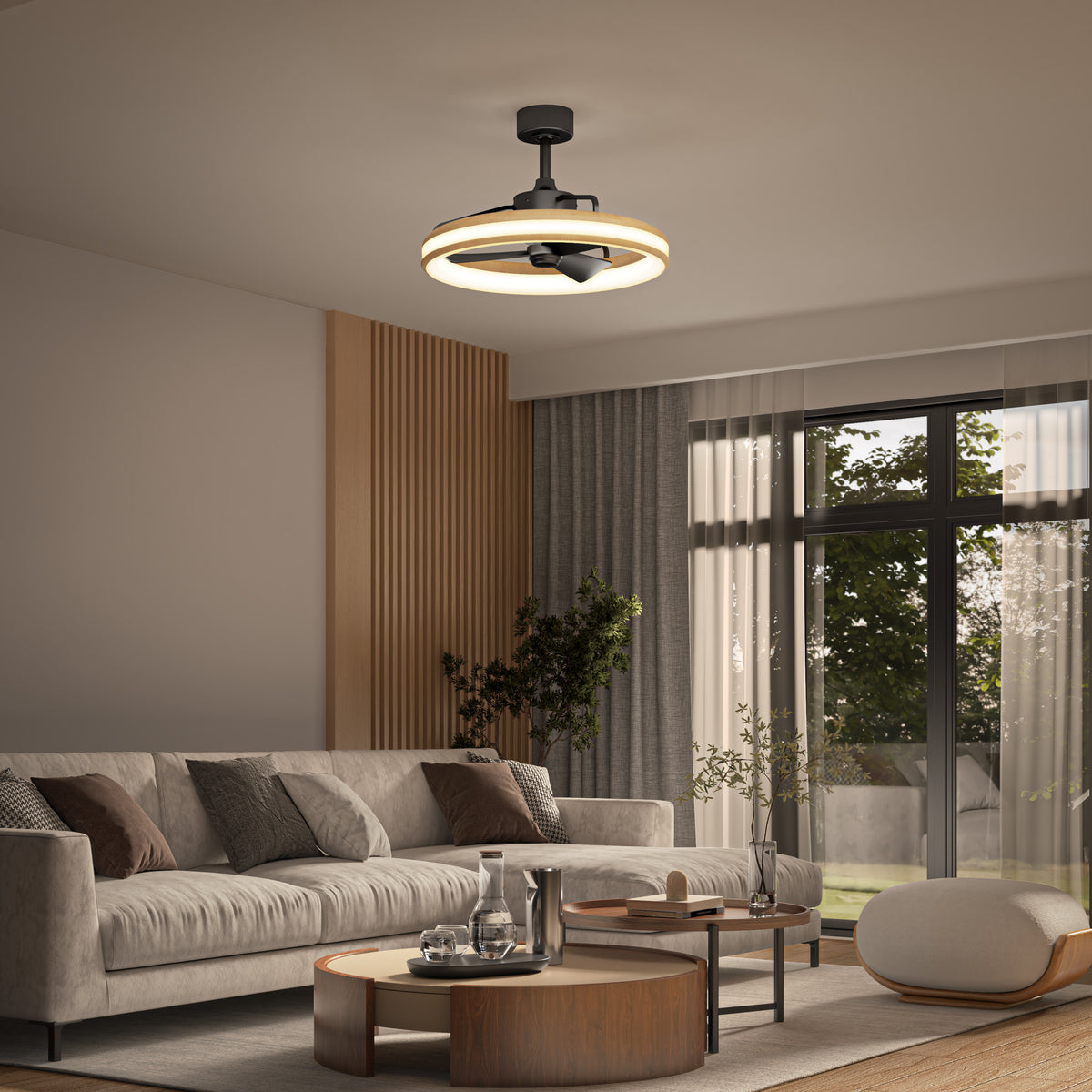 Modern living room featuring a beige sectional sofa, round coffee tables, a plant, sheer curtains on floor-to-ceiling windows, and the Artika Lugano 23 in. LED modern ceiling fan with remote elegantly centered on the ceiling.