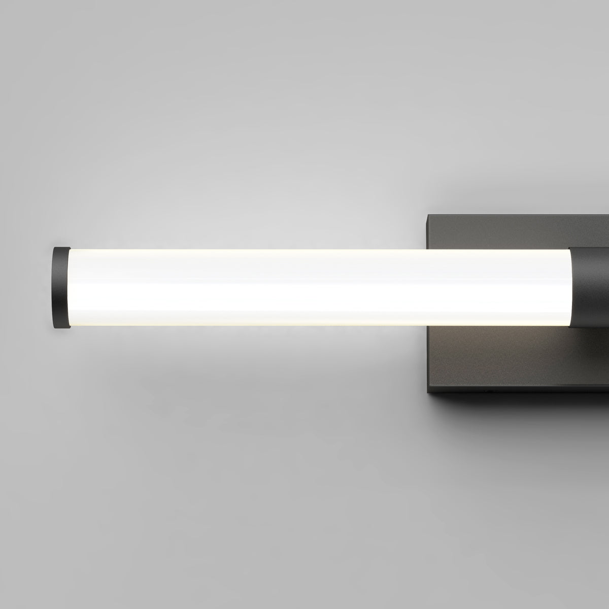 The Artika Vitoro modern LED bathroom vanity light features a sleek, wall-mounted cylindrical design with a black base, providing bright white illumination—ideal for stylish, contemporary home bathrooms.