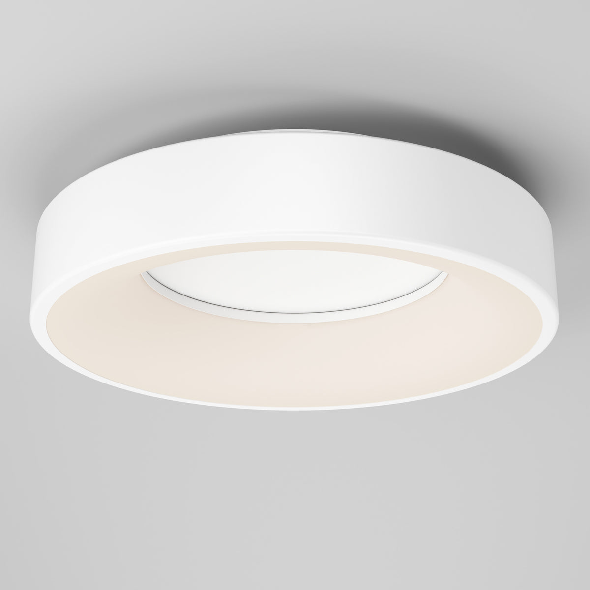 The Artika Aiden LED flush mount is a modern round white ceiling light with a sleek design, installed on a light gray ceiling and providing a soft, even glow.