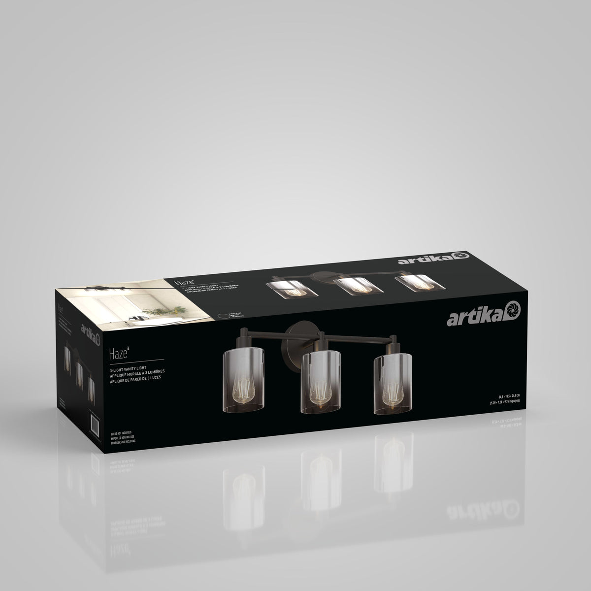 The Artika Haze modern 3-light bathroom vanity light glass comes in black box packaging, showing the fixture with cylindrical glass shades and exposed bulbs on a plain gray background.