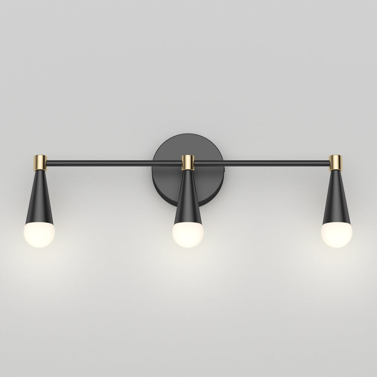 The Artika Wayden LED mid-century vanity light features 3 cone-shaped black and gold fixtures on a round base with glowing bulbs.