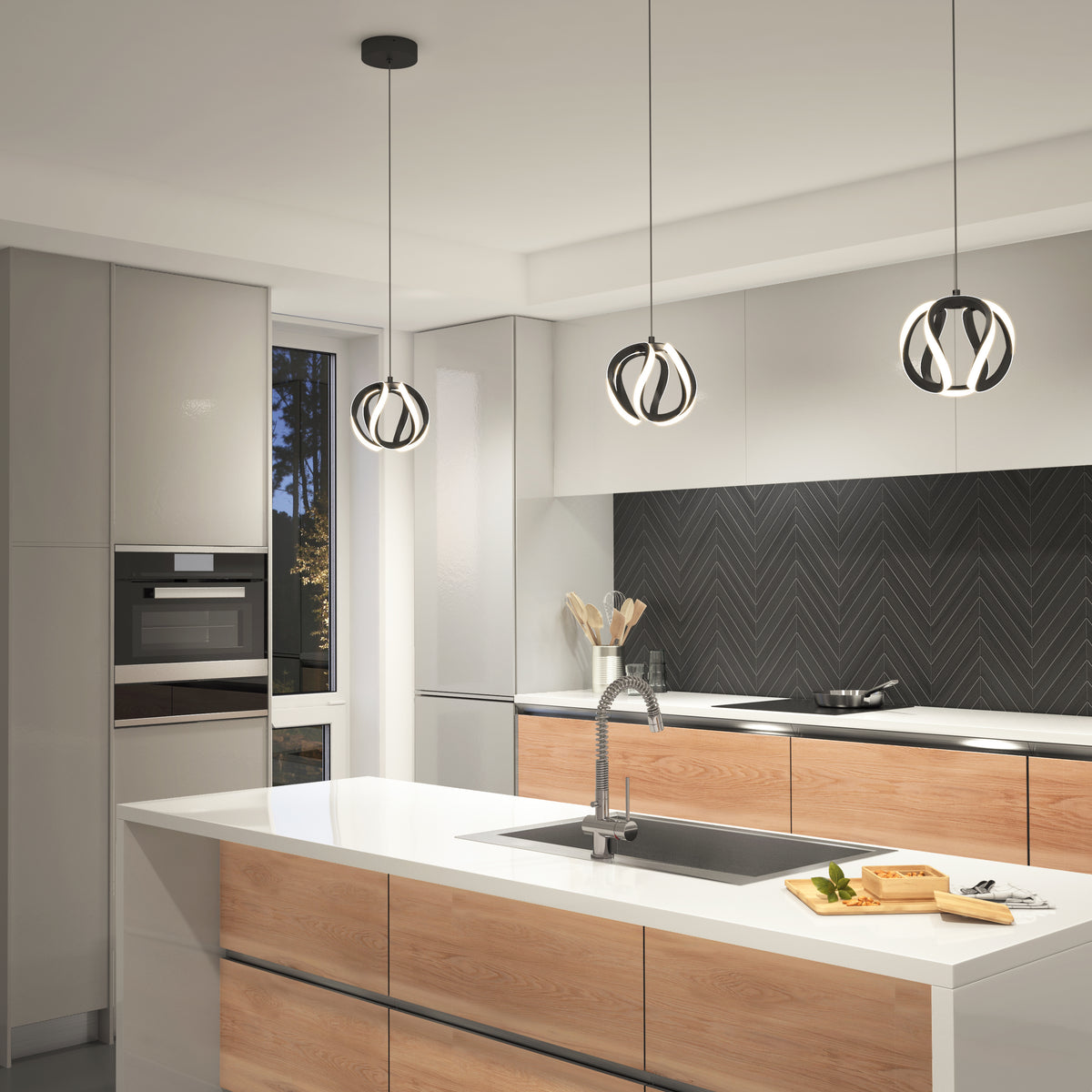 Modern kitchen with central island, wood and white cabinets, built-in oven, black herringbone backsplash, and three Artika Vivaldi LED pendant lights (3 CCT) hanging above the island’s sink and cutting board.