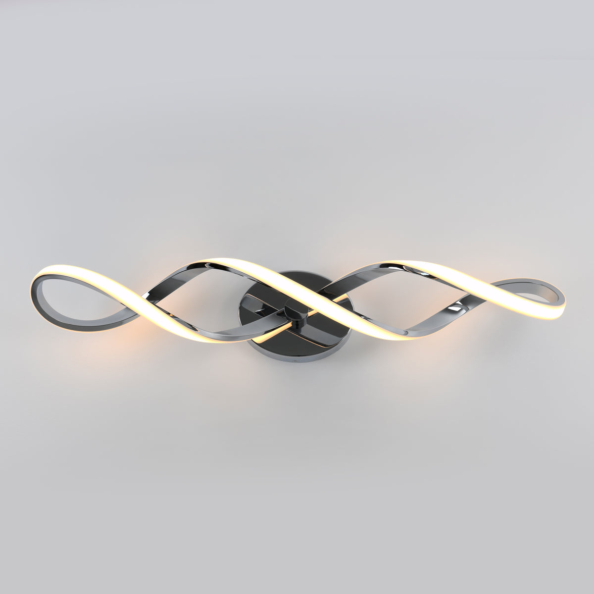 The Artika Swirl modern LED bathroom vanity light features two intertwined, wave-like metal arms with integrated LEDs, mounted on a circular base against a plain light gray background.