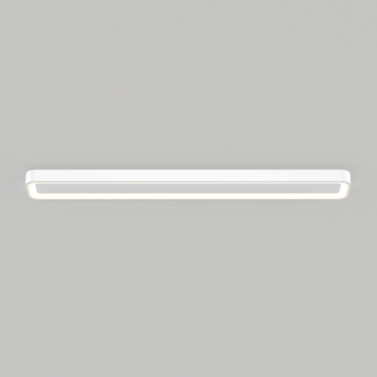 The Artika Aiden 48 in. LED modern flush mount light 5 CCT, featuring a sleek rectangular design with rounded edges, is mounted on a light gray ceiling and delivers adjustable, even illumination with a soft glow around the edges.
