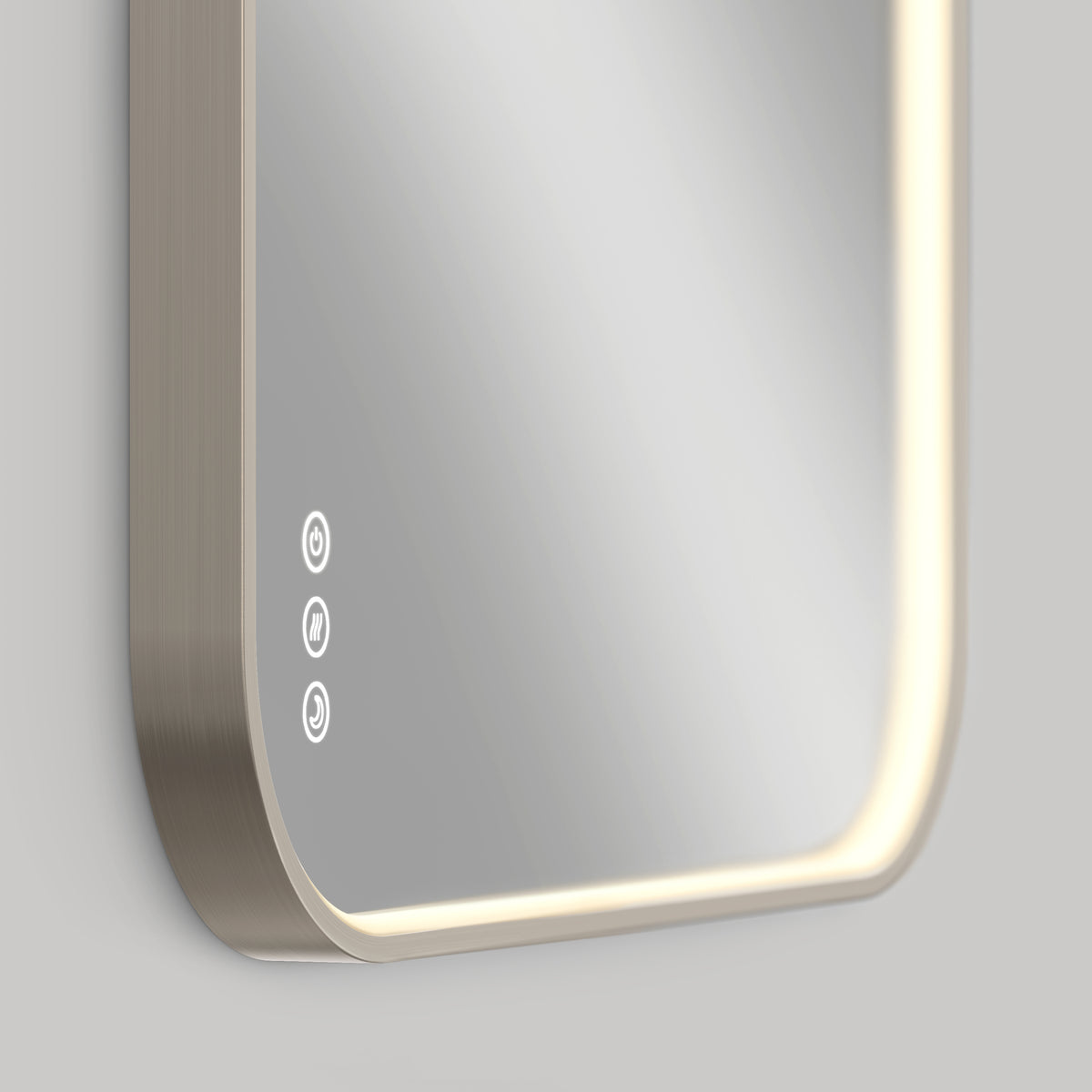 A close-up of the Artika Royce Dimmable LED Mirror, 3 CCT, mounted horizontally, shows rounded edges, built-in adjustable LED lighting, three illuminated touch controls, and a defogger icon on the lower left.