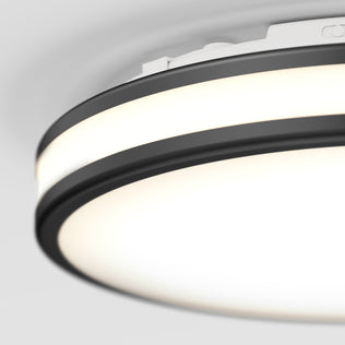 Close-up of Artika Hemisphere 15″ LED Flush Mount Ceiling Light, black trim, bright white glow, 5 CCT adjustable brightness.