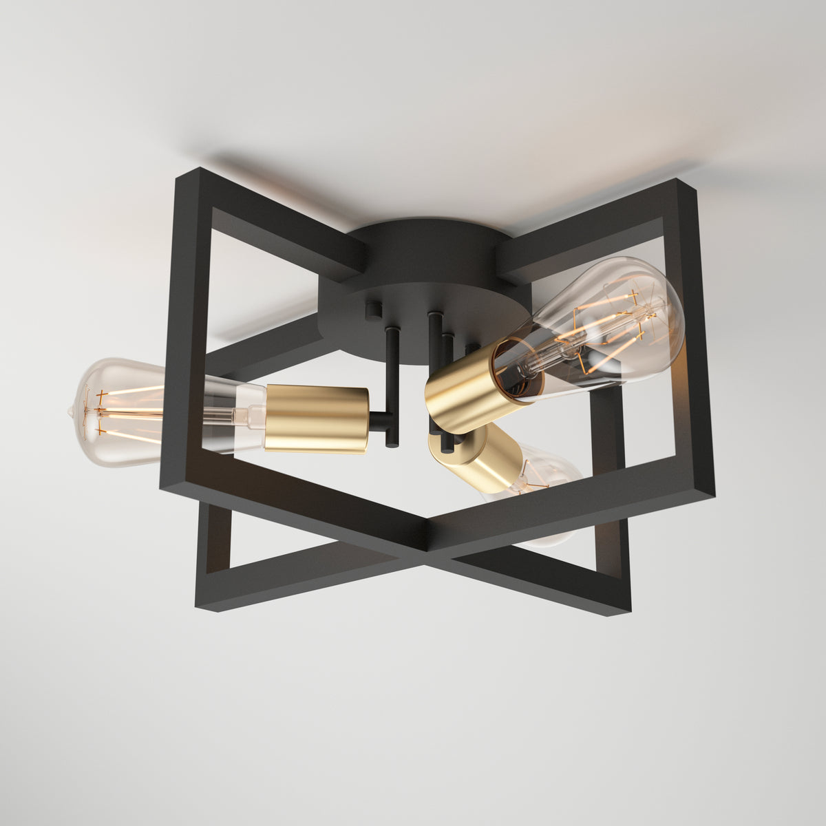 A modern ceiling light fixture with a geometric black metal frame, gold sockets, and three exposed vintage-style bulbs, mounted on a white ceiling.