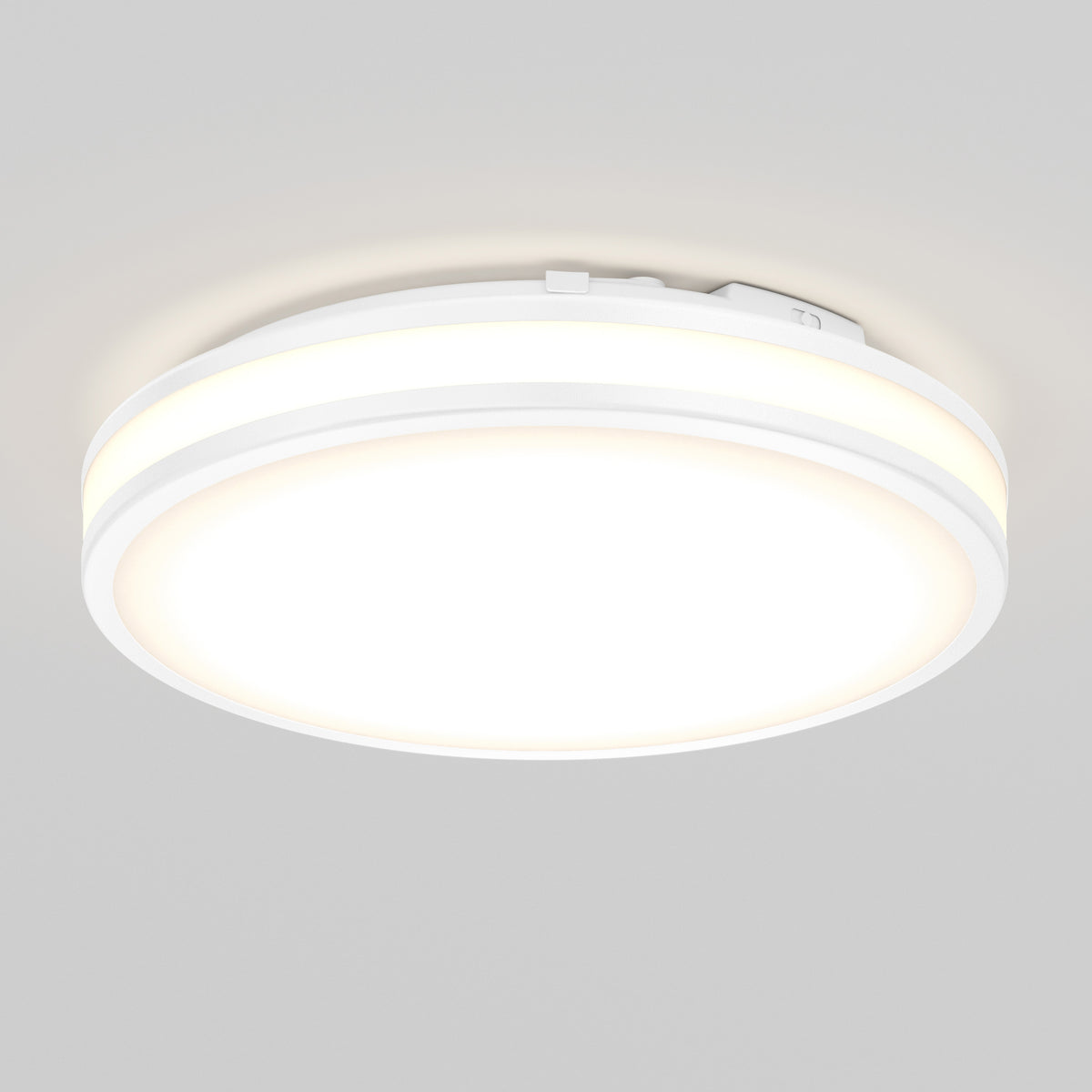 The Artika Hemisphere 15 in. LED flush mount light features a round, white design with a glowing center and thin illuminated edge, and is mounted on a plain light gray ceiling.