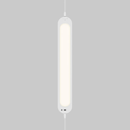 The Artika Impulse Under-Cabinet LED Light RGB+CCT with Remote glows softly, hanging vertically against a plain grey background.