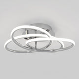 A modern ceiling light fixture with two intertwined, illuminated LED rings in a chrome finish, mounted on a round base against a plain light gray background.