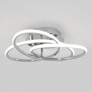 The Artika Swirl Butterfly LED contemporary flush mount light features three interlocking, illuminated chrome rings on a round base, shown here against a plain light gray background.