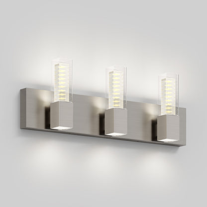 The Artika Hologram LED modern bathroom vanity light 5 CCT is a wall-mounted fixture featuring three rectangular LED lights in clear casings on a brushed metal base, ideal for illuminating white bathroom walls.