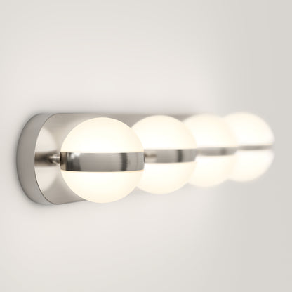 A modern wall-mounted light fixture with three glowing spherical bulbs, each encased in frosted glass and connected by a sleek, horizontal metallic bar on a white background.