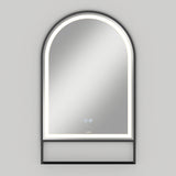 An arched, wall-mounted mirror with an illuminated LED border and a small open shelf at the bottom, set against a light gray background.