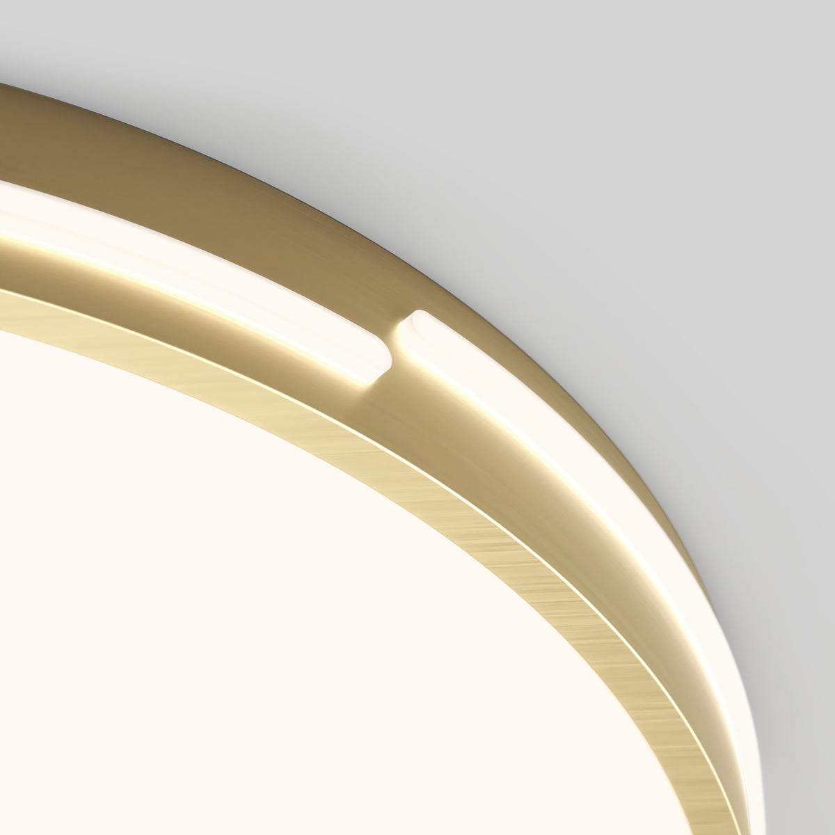 Close-up of the Artika Delray 15.7 in. LED modern flush mount light with a brushed gold rim and integrated LED strip, emitting a soft white glow against a light gray background. Features 5 selectable CCT options.